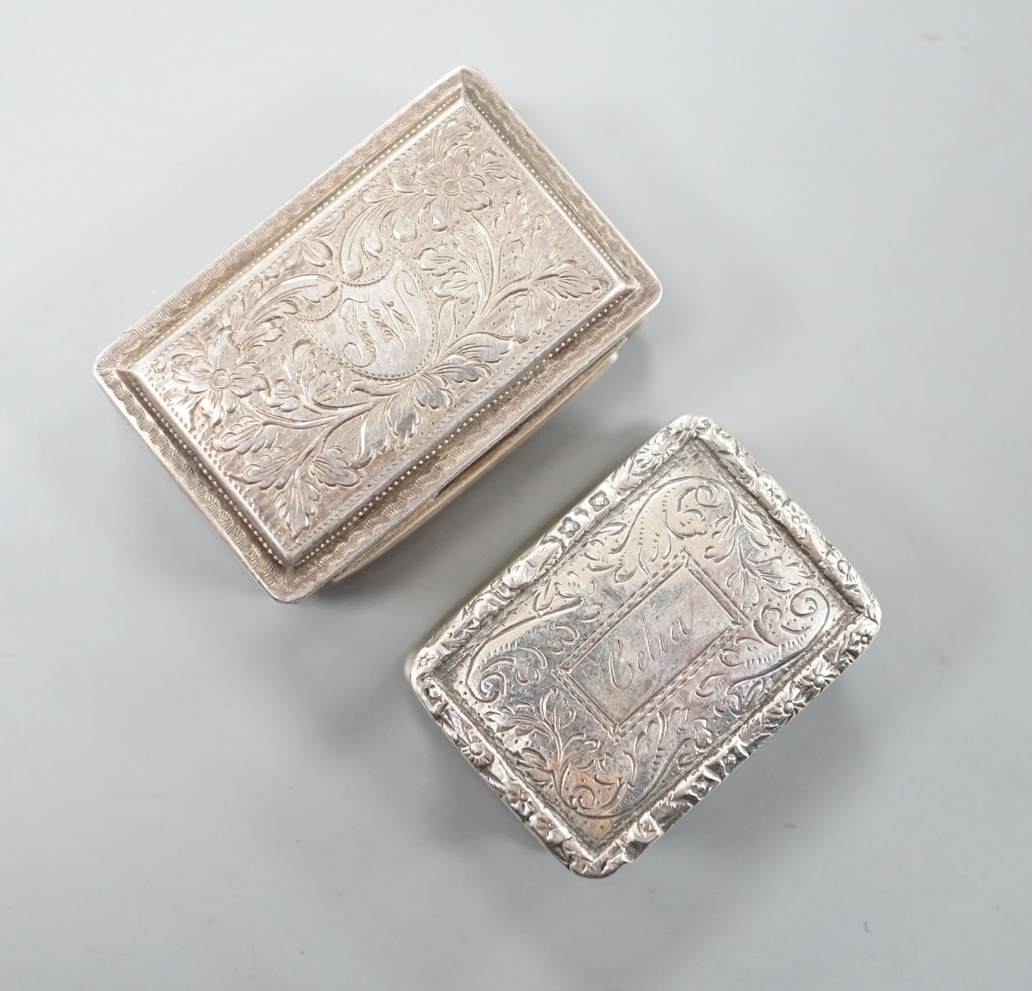 A George IV engraved silver rectangular vinaigrette, by Nathaniel Mills, Birmingham, 1827, engraved 'Celia', 31mm and a later vinaigrette, Birmingham, 1833.